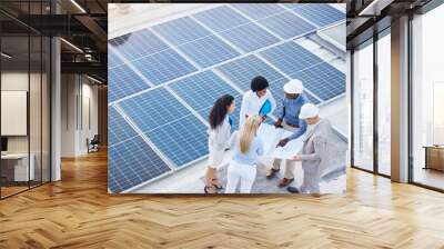 Solar energy, design or engineering team on roof building sustainable future electricity technology innovation. Collaboration, top or black man talking or planning a construction project with people Wall mural