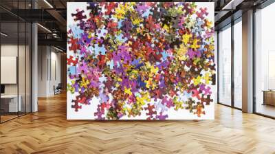 Abstract and colourful puzzle pieces scattered on a table Wall mural