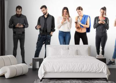 Group of casual people using cell phones full body isolated on white background.  Wall mural