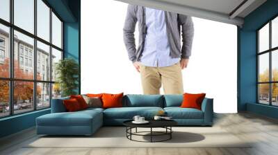 well dressed man fashion model in gray cardigan looking up with hands in back pockets. full body len Wall mural