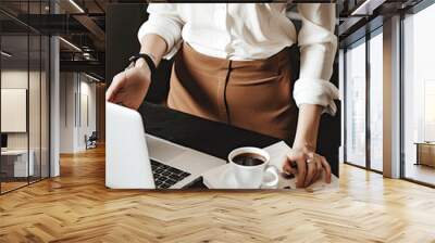 a woman standing in front of a laptop, open coffee cup, light gold and brown, black and white, female mockup, ai generative Wall mural