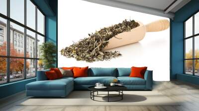 Dried, raw white tea leaves in wooden scoop over white background Wall mural