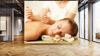 An attractive woman getting spa treatment Wall mural