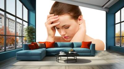 Young woman with head pain on white background Wall mural