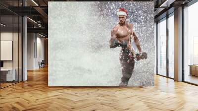 Holidays and celebrations, New year, Christmas, sports, bodybuilding, healthy lifestyle - Muscular handsome sexy Santa Claus, Ded Moroz Wall mural