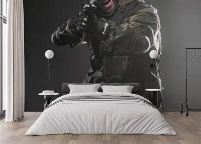 soldier man hold Machine gun on a  dark background Wall mural