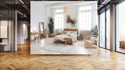 Cozy rustic bedroom with boho ethnic decor. Bright spacious apartment with large windows. Nobody. Wooden furniture. Boudoir table. Large mirror. Handmade textile. Plants in the interior. Wall mural