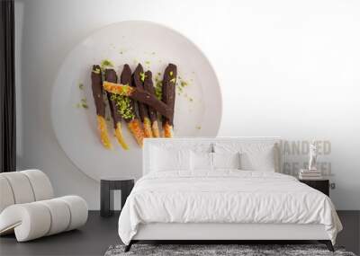 Candied orange peel in chocolate or sugar is a favorite Christmas treat for children and adults. Image of homemade candied orange peel some pieces dipped in chocolate. Top view Wall mural