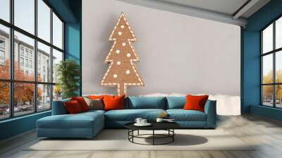 Christmas card with a picture of a Christmas tree made of cardboard on a gray background Wall mural