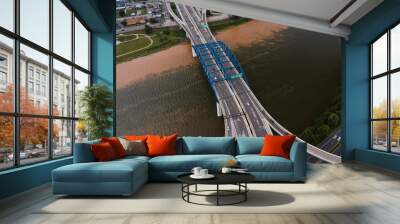 This is an aerial of a blue, eight-lane highway arch bridge that carries Interstate 64 over the Kanawha River in Charleston, West Virginia. Wall mural