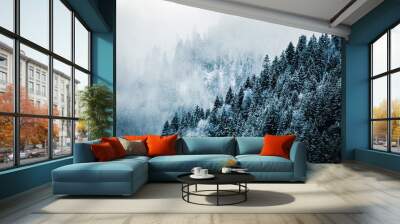 Moody snow covered forest landscape with blue fog and mist in the mountains Wall mural