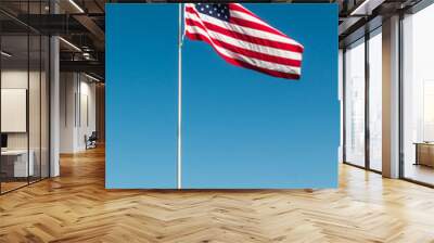 American Flag with the background of a blue sky.   Wall mural