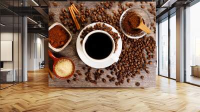 Cup of black coffee with coffee beans. Wall mural