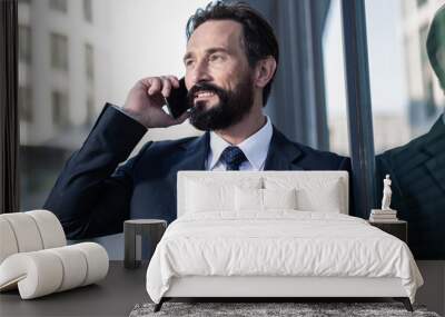 Close up of a positive businessman talking on phone Wall mural