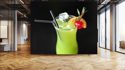 green exotic alcoholic drink cocktail on black background Wall mural