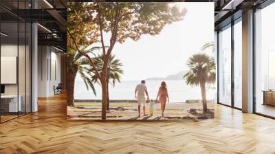 unidentified family vacation on luxury beach Wall mural