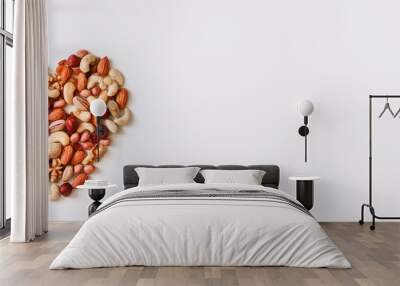 Mixed nuts forming a heart shape isolated on white background. Top view or flat lay Wall mural