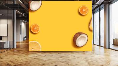 Tropical fruit flat lay with pineapple, oranges, lemon and coconut on a pastel background. Wall mural