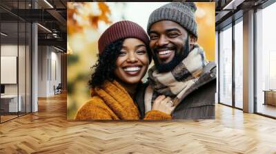 A stylish couple with a sunny smile in a natural autumn scene Wall mural