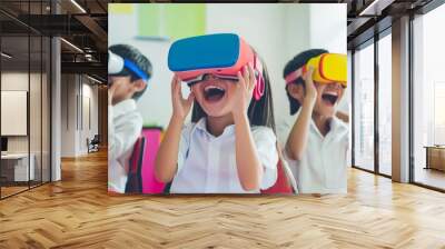 Children in the classroom wear colorful VR glasses and laugh happily Wall mural