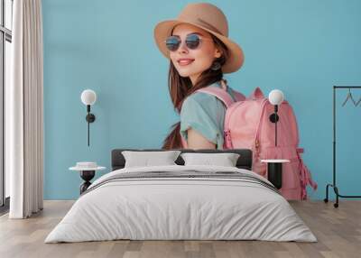 Happy young Asian female tourists wear beach hats, sunglasses and backpacks on holiday trips. Wall mural