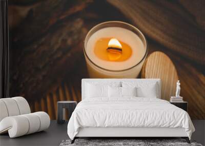 Burning candle in home interior, autumn aesthetics Wall mural