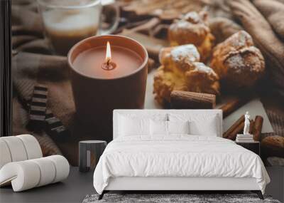 Burning candle with the smell of chocolate and cinnamon in a cozy home interior Wall mural