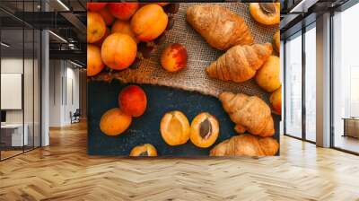 Fresh apricots and croissants on a burlap cloth Wall mural