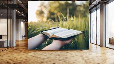 Open bible in hands close-up, concept of calmness and morning solitude Wall mural