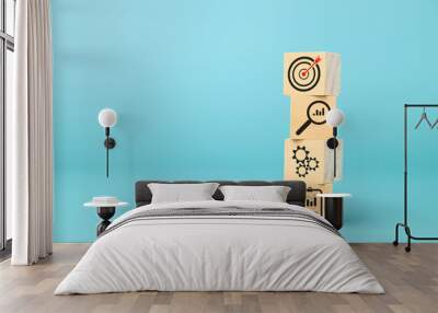 Wooden block of target board with business icons Wall mural