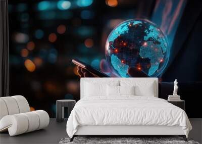 A businessman holds a glowing blue globe in his hands, representing global connectivity and technology. Wall mural