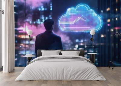 A businessman looking out a window at a glowing cloud icon representing data and technology. Wall mural