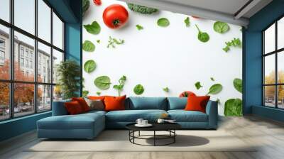 A flat lay of fresh vegetables including tomatoes, spinach, and broccoli on a white background. The vegetables are arranged in a frame shape, leaving space for text or a product in the center. Wall mural