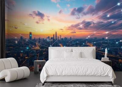 A panoramic view of a modern city at sunset with a network of glowing lines connecting buildings, symbolizing communication, technology, and global connectivity. Wall mural