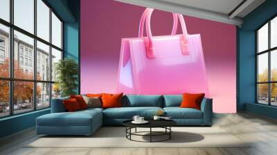 A pink transparent handbag with two handles stands on a pink background. Wall mural