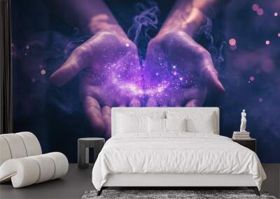 Open hands with glowing purple light and smoke, symbolizing power, magic, and possibility. Wall mural