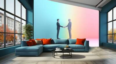 Two businessmen shaking hands in front of a colorful background, symbolizing agreement and partnership. Wall mural