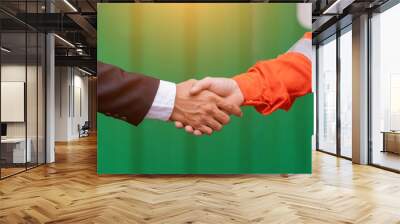 Engineers shake hands with businessman. Wall mural