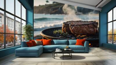 Grilled steak with steam and smoke rising, on a rustic grill by the beach with ocean waves in the background. Wall mural