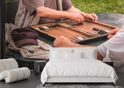 Board game of backgammon.Two old adult men playing backgammon in the street,hobby Wall mural