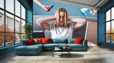 Informational digital detox. Fake news. A girl in stress and anxiety of depression closed her ears. He does not hear false information about the corona virus covid 19. Wall mural