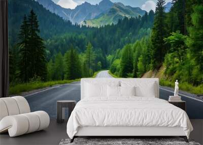 Asphalt road through the green forest with sunlight in the morning. Wall mural