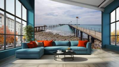 A view of the two jetties at Rapid Bay, one new and one old with blue sea and under an overcast sky at this world famous scuba and snorkeling site on the Fleurieu Peninsula in South Australia. Wall mural