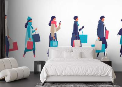 Some people carrying shopping bags at winter. Man and woman taking part in seasonal sale at store, shop, mall. Wall mural