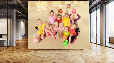 Happy sporty children in gym Wall mural