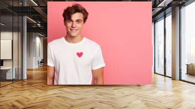 Smiling man wearing t-shirt with drawn heart isolated on pink background. AI Generated. Wall mural