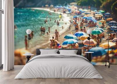 A beach scene with many people and umbrellas Wall mural