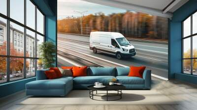 A white van is driving down a road with trees in the background. Wall mural