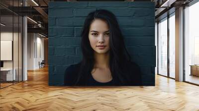 A woman with long black hair is standing in front of a brick wall, generative ai image Wall mural