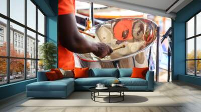 man is playing on a steel drums at cruise ship open deck Wall mural